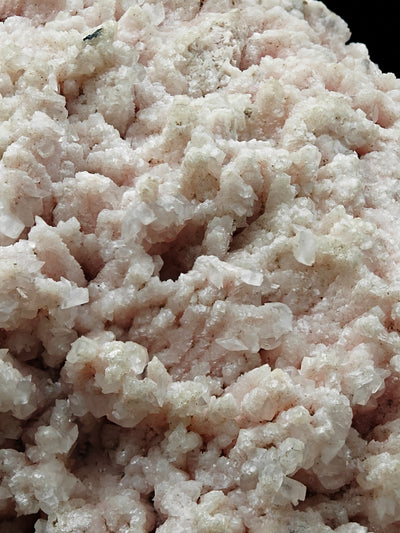 Macro view of interlocking Rhodochrosite and Calcite crystal clusters