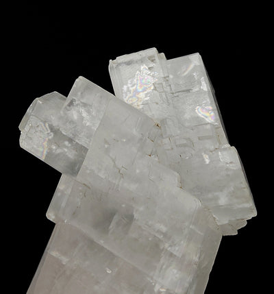 Close-up of twinned calcite crystal showing sharp facets and transparency