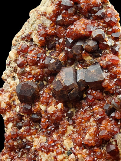 Close-up of large dodecahedral spessartine garnet crystals on matrix, Fujian