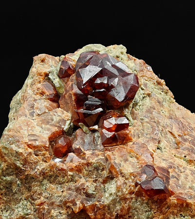 Close-up of brown-red grossular garnet crystal cluster, Vogogna, Piedmont