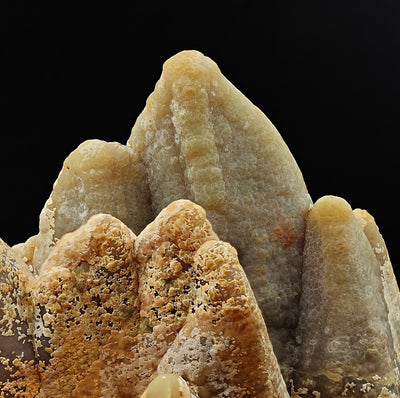 Close-up of smithsonite crystal peaks with drusy beige-orange coating, Sardinia