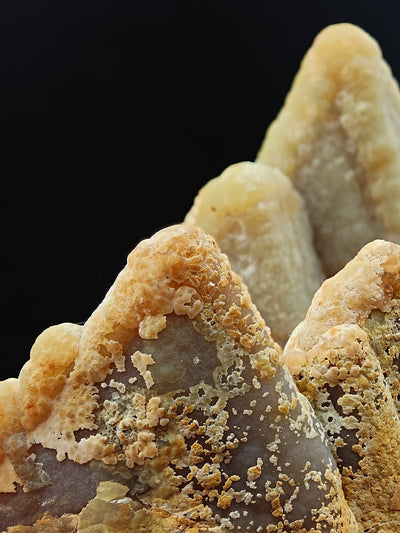 Macro view of drusy smithsonite crust revealing translucent crystal interior, Sardinia, Italy