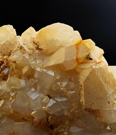 Close-up of Quartz crystals showing honey-yellow zoning and surface Limonite staining