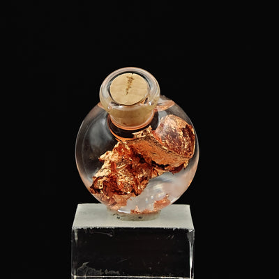 Glass vial on stone base with native copper foil leaf, cork stopper