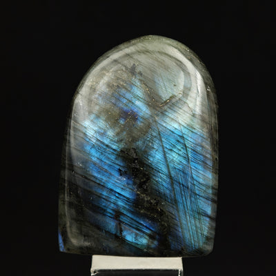 Labradorite specimen with blue streaks across grey base, Madagascar