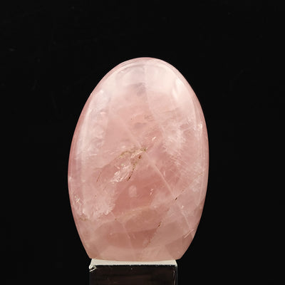 Rose Quartz tumbled stone with warm pink tone and light inclusions