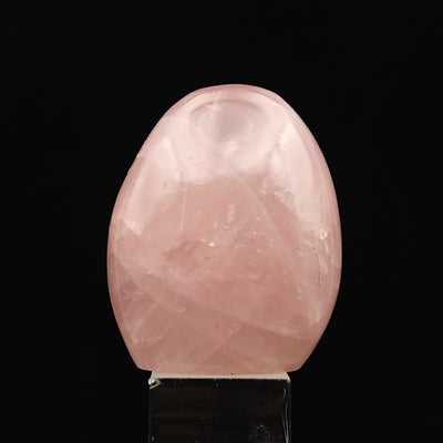 Rose Quartz tumbled stone with rounded top and pale pink banding
