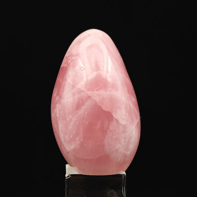 Polished Rose Quartz tumbled stone showing natural white veining