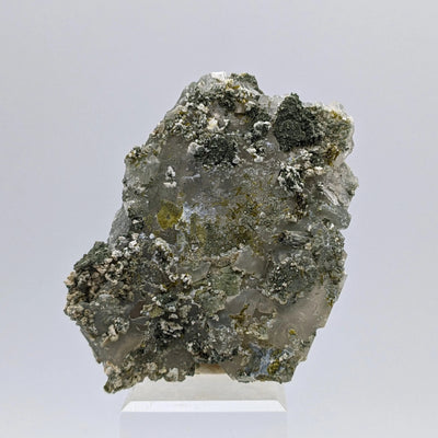 Back view of Quartz matrix showing scattered green Epidote crystals, Switzerland