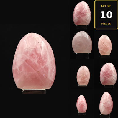 Overview of 10 pink Rose Quartz tumbled stones displayed on stands